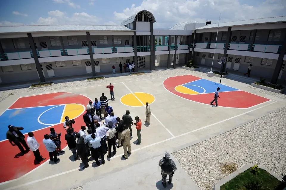 Students gathered on a colorful basketball court